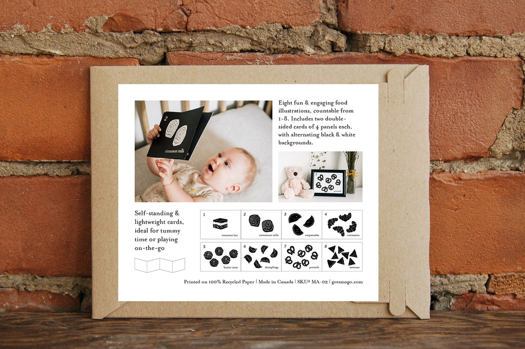 Product packaging with baby illustrations and text on a brick wall background