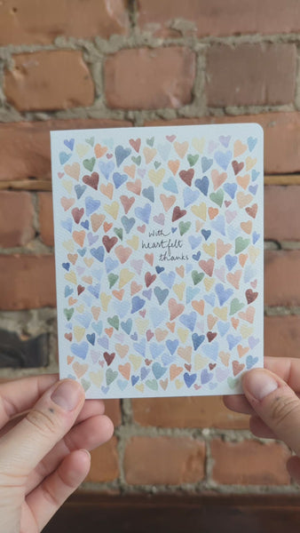 Video of Heartfelt Thanks Greeting Card. The video shows the card held by a hand against a brick background, with some close up shots.