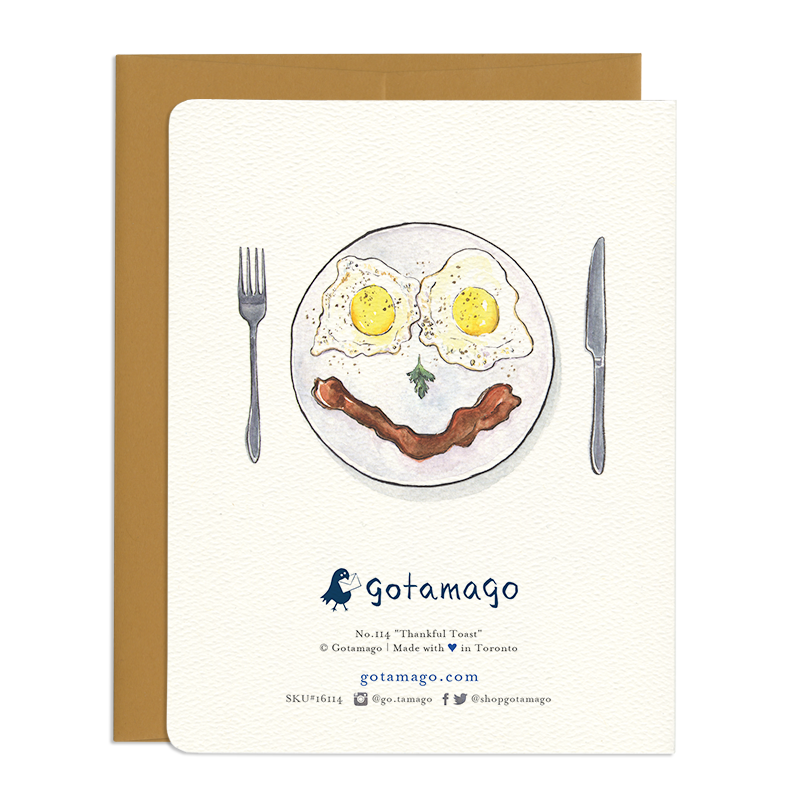 Card back features a watercolour and ink drawing of a plate of bacon and eggs in the shape of a smiling face.