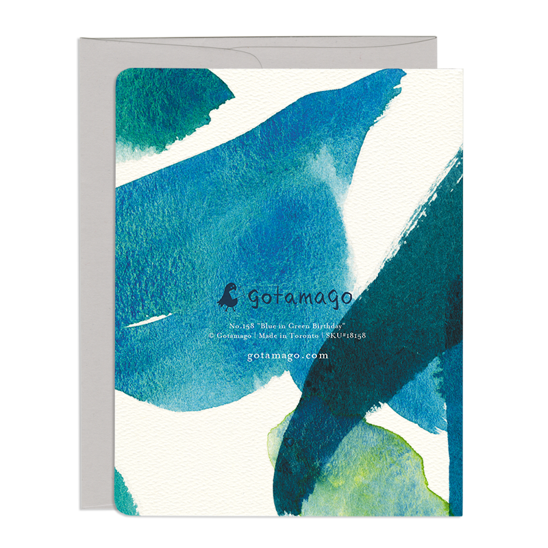 Card back featured abstract, overlapping streaks of blue and green in wrap-around.
