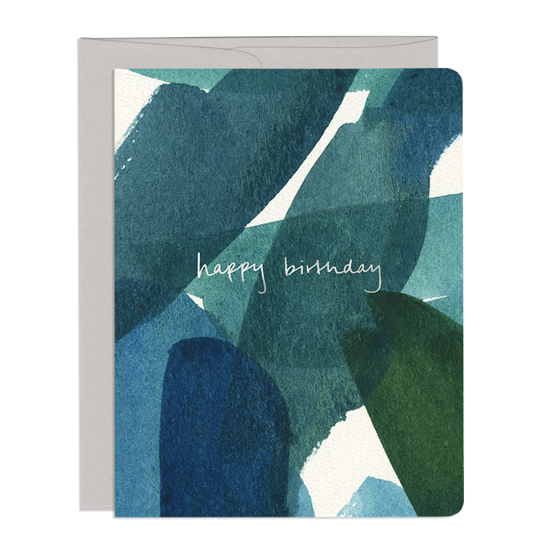 Card front features overlapping, abstract watercolour streaks of blue and green. Foiled hand-lettering reads: happy birthday.