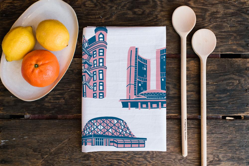 This exquisite tea towel features Toronto's City Hall, the Flatiron Building and Roy Thompson Hall when folded.